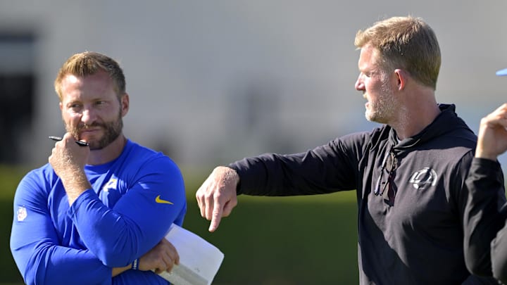 Jul 29, 2024; Los Angeles, CA, USA; Los Angeles Rams head coach Sean McVay, general manager Les Snead and chief of staff Carter Crutchfield talk on the field during training camp at Loyola Marymount University. Mandatory Credit: Jayne Kamin-Oncea-Imagn Images