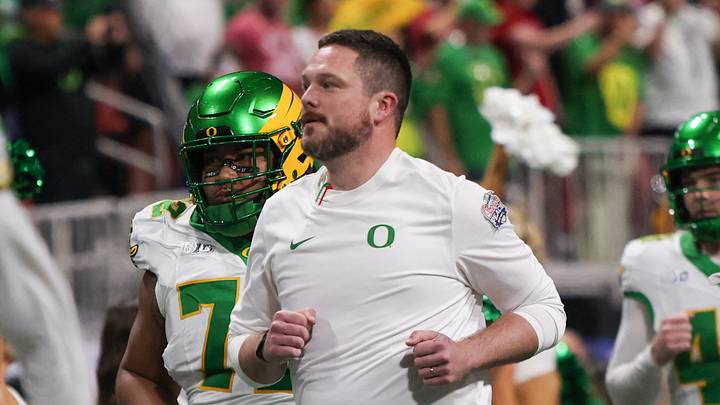 Jan 9, 2026; Atlanta, GA, USA; Oregon Ducks head coach Dan Lanning leads his team onto the field prior to the 2025 Peach Bowl and semifinal game of the College Football Playoff against the Indiana Hoosiers at Mercedes-Benz Stadium. Mandatory Credit: Brett Davis-Imagn Images Jan 9, 2026; Atlanta, GA, USA; Oregon Ducks head coach Dan Lanning leads his team onto the field prior to the 2025 Peach Bowl and semifinal game of the College Football Playoff against the Indiana Hoosiers at Mercedes-Benz Stadium. Mandatory Credit: Brett Davis-Imagn Images