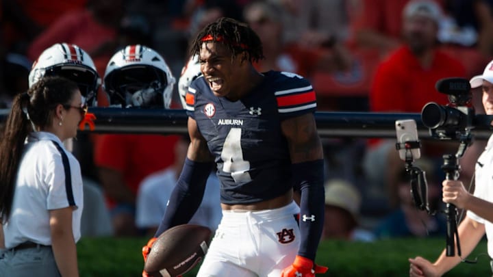 Auburn Tigers defensive back Kayin Lee celebrates his interception against the Arkansas Razorbacks.