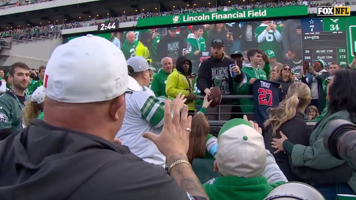 Philadelphia Eagles fans pass a Tanner McKee touchdown ball.