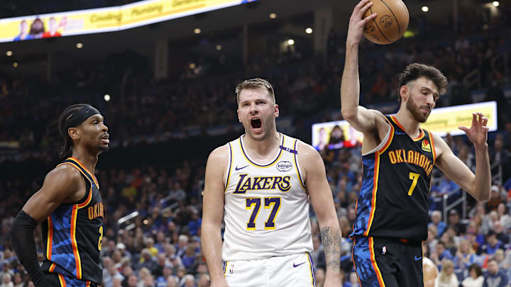 Apr 6, 2025; Oklahoma City, Oklahoma, USA; Los Angeles Lakers guard Luka Doncic (77) yells after scoring against the Oklahoma City Thunder during the second quarter at Paycom Center. Mandatory Credit: Alonzo Adams-Imagn Images