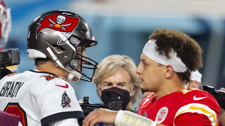 Tampa Bay Buccaneers quarterback Tom Brady greets Kansas City Chiefs quarterback Patrick Mahomes.