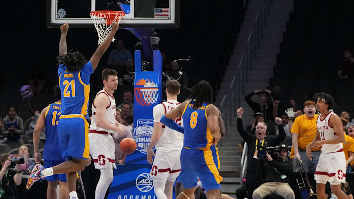Mar 10, 2026; Charlotte, NC, USA; Pittsburgh Panthers players celebrate as guard Damarco Minor (7) hits a follow shot with 1 second left in the second half at Spectrum Center. Mandatory Credit: Bob Donnan-Imagn Images
