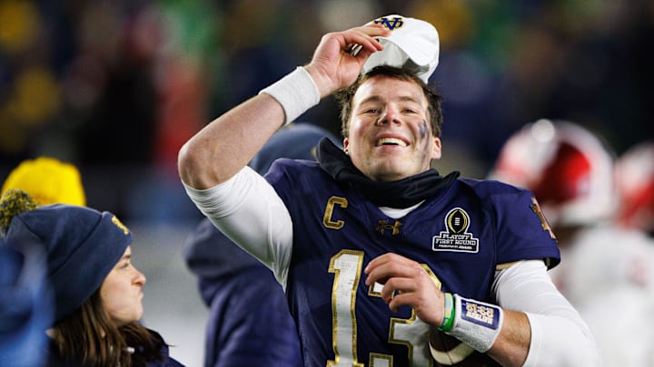Notre Dame quarterback Riley Leonard (13) celebrates after winning the first round of the College Football Playoff 27-17 against Indiana at Notre Dame Stadium on Friday, Dec. 20, 2024, in South Bend.