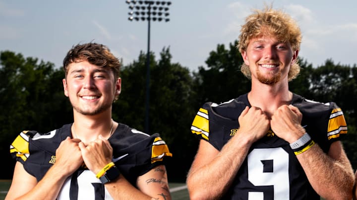 Quarterbacks Jeremy Hecklinski, Hank Brown and Jackson Stratton stand for a photo as Iowa Football hosts media day on Aug. 8, 2025, in Iowa City.