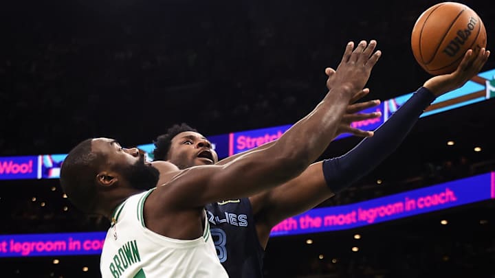 Nov 12, 2025; Boston, Massachusetts, USA; Memphis Grizzlies forward Jaren Jackson Jr. (8) goes to the basket against Boston Celtics guard Jaylen Brown (7) during the second quarter at TD Garden. Mandatory Credit: Winslow Townson-Imagn Images