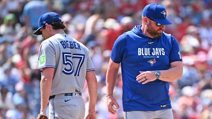 Former Cy Young winner and Blue Jays pitcher Shane Bieber (left) has only pitched into the seventh inning once in nine games this year.