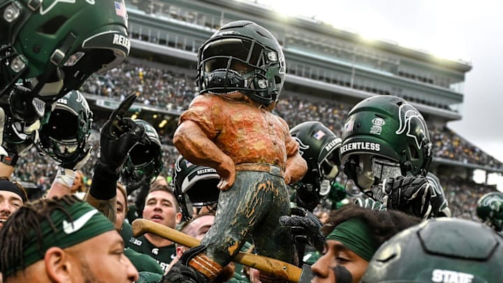 Michigan State celebrates with the Paul Bunyan Trophy after beating Michigan on Saturday, Oct. 30, 2021, at Spartan Stadium in East Lansing. Michigan State celebrates with the Paul Bunyan Trophy after beating Michigan on Saturday, Oct. 30, 2021, at Spartan Stadium in East Lansing.