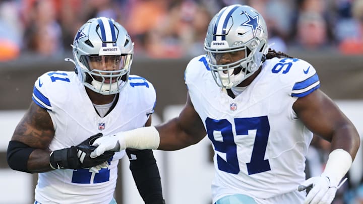 Dallas Cowboys linebacker Micah Parsons (11) celebrates with defensive tackle Osa Odighizuwa (97) 