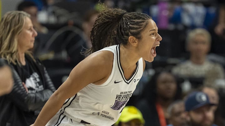 Sep 14, 2025; Minneapolis, Minnesota, USA; Golden State Valkyries guard Veronica Burton (22) celebrates after making a three point shot against the Minnesota Lynx in the first half during game one of round one for the 2025 WNBA Playoffs at Target Center. Mandatory Credit: Jesse Johnson-Imagn Images