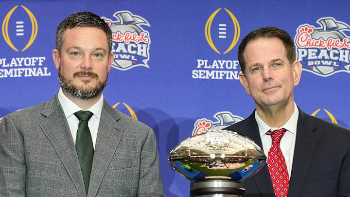Oregon Ducks head coach Dan Lanning and Indiana Hoosiers head coach Curt Cignetti smile for a photo Thursday, Jan. 8, 2026, during a coaches' press conference ahead of the College Football Playoff Peach Bowl game at the College Football Hall of Fame in Atlanta. Oregon Ducks head coach Dan Lanning and Indiana Hoosiers head coach Curt Cignetti smile for a photo Thursday, Jan. 8, 2026, during a coaches' press conference ahead of the College Football Playoff Peach Bowl game at the College Football Hall of Fame in Atlanta.