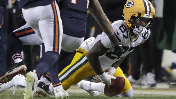 Green Bay Packers receiver Romeo Doubs (87) mishandles an onside kick against the Chicago Bears.