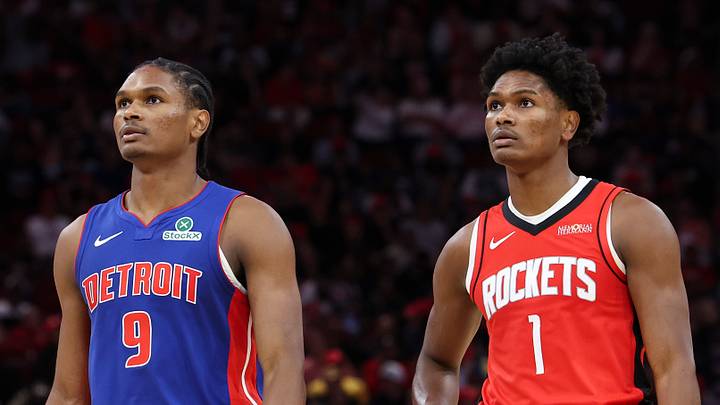 Oct 24, 2025; Houston, Texas, USA; Detroit Pistons guard Ausar Thompson (9) and twin brother Houston Rockets guard Amen Thompson (1) stand on the court during the third quarter at Toyota Center. Mandatory Credit: Troy Taormina-Imagn Images