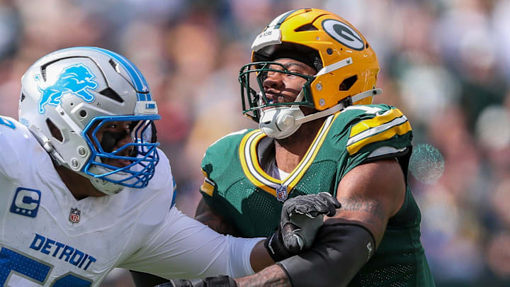 Green Bay Packers defensive end Micah Parsons (1) fights through a block by Detroit Lions offensive tackle Penei Sewell.