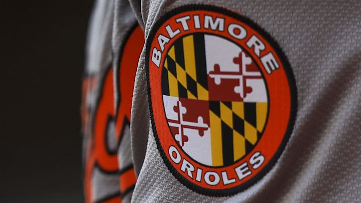 May 5, 2024; Cincinnati, Ohio, USA; The Baltimore Orioles logo on the sleeve of designated hitter Gunnar Henderson (2) as he prepares on deck during the seventh inning against the Cincinnati Reds at Great American Ball Park.