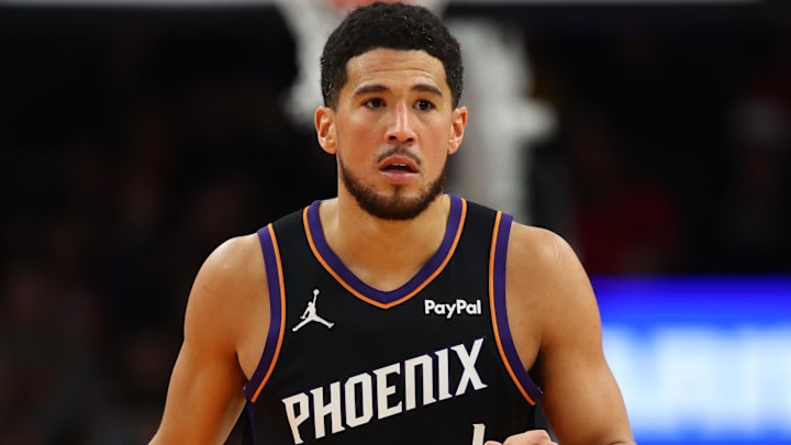 Dec 23, 2025; Phoenix, Arizona, USA; Phoenix Suns guard Devin Booker (1) against the Los Angeles Lakers at Mortgage Matchup Center. Mandatory Credit: Mark J. Rebilas-Imagn Images