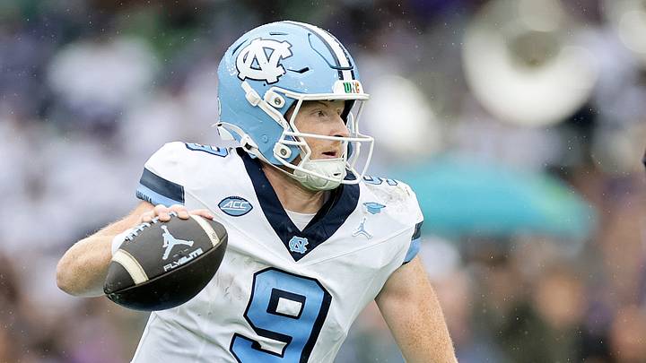 Aug 29, 2026; Dublin, Co. Dublin, IRL;  North Carolina Tar Heels quarterback Billy Edwards Jr. (9) runs the ball against TCU Horned Frogs linebacker Paul Oyewale (97) in the first half at Aviva Stadium.  Mandatory Credit: Laszlo Geczo-Imagn Images