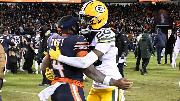 Jan 10, 2026; Chicago, IL, USA; in Chicago Bears running back D'Andre Swift (4) and Green Bay Packers cornerback Trevon Diggs (28) hug after an NFC Wild Card Round game at Soldier Field. M