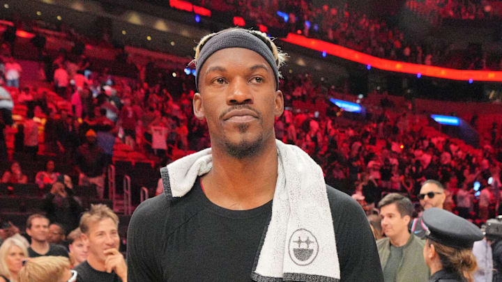 Jan 19, 2025; Miami, Florida, USA;  Miami Heat forward Jimmy Butler (22) walks off the court after greeting court-side friends following the victory over the San Antonio Spurs at Kaseya Center. Mandatory Credit: Jim Rassol-Imagn Images
