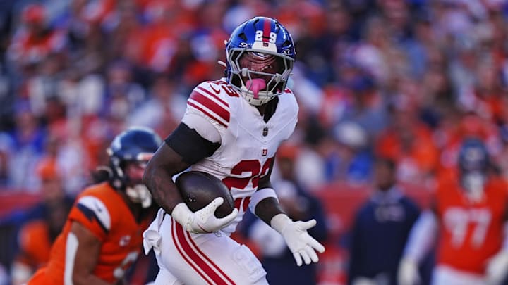 Oct 19, 2025; Denver, Colorado, USA; New York Giants running back Tyrone Tracy Jr. (29) runs the ball during the second half against the Denver Broncos at Empower Field at Mile High. Oct 19, 2025; Denver, Colorado, USA; New York Giants running back Tyrone Tracy Jr. (29) runs the ball during the second half against the Denver Broncos at Empower Field at Mile High.