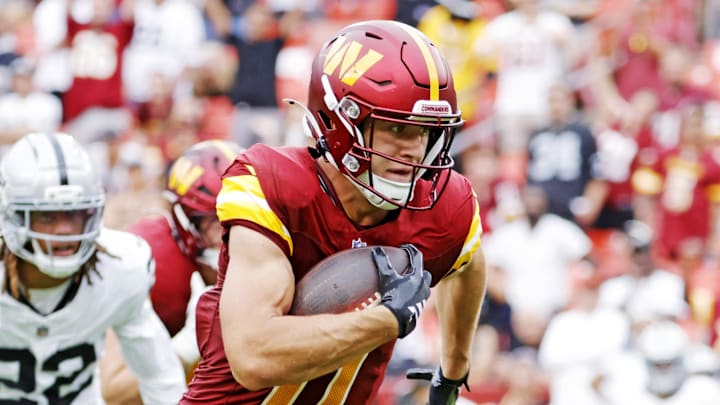 Sep 21, 2025; Landover, Maryland, USA; Washington Commanders wide receiver Luke McCaffrey (11) runs for a touchdown during the second half against the Las Vegas Raiders at Northwest Stadium. Mandatory Credit: Amber Searls-Imagn Images