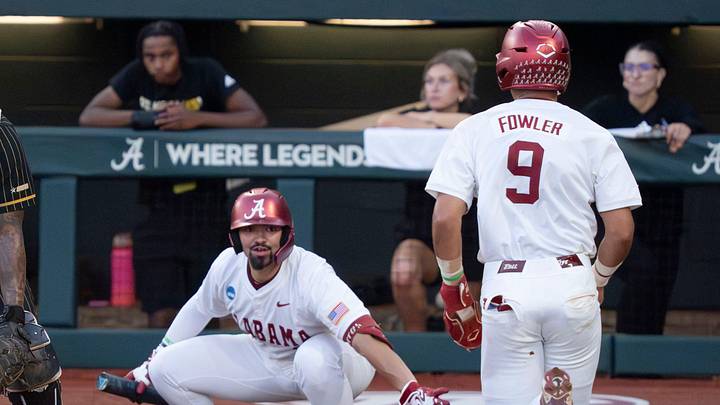 May 29, 2026; Tuscaloosa, AL, USA; Alabama base runner Bryce Fowler (9) comes home as Alabama batter Jason Torres (32) signals for a slide in the Tuscaloosa NCAA Regional baseball game between Alabama and Alabama State in Sewell-Thomas Stadium. May 29, 2026; Tuscaloosa, AL, USA; Alabama base runner Bryce Fowler (9) comes home as Alabama batter Jason Torres (32) signals for a slide in the Tuscaloosa NCAA Regional baseball game between Alabama and Alabama State in Sewell-Thomas Stadium.