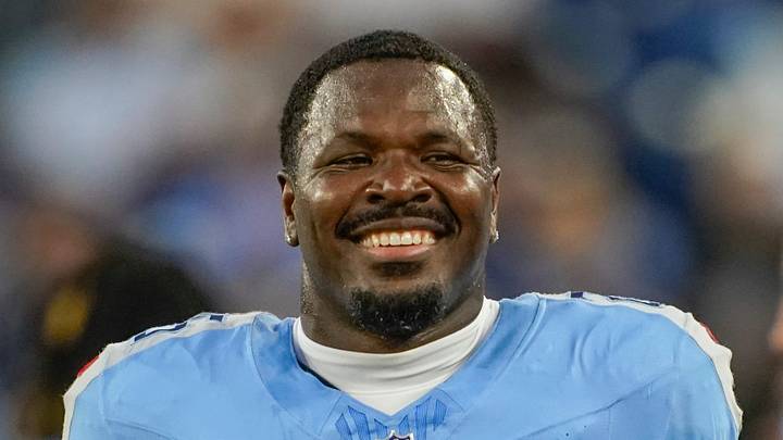 Tennessee Titans safety Xavier Woods (25) smiles from the sidelines