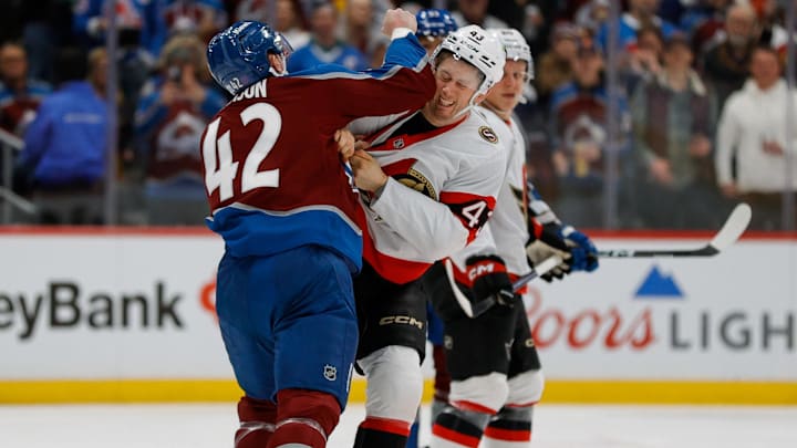 Jan 8, 2026; Denver, Colorado, USA; Colorado Avalanche defenseman Josh Manson (42) and Ottawa Senators defenseman Tyler Kleven (43) fight in the first period at Ball Arena. Mandatory Credit: Isaiah J. Downing-Imagn Images