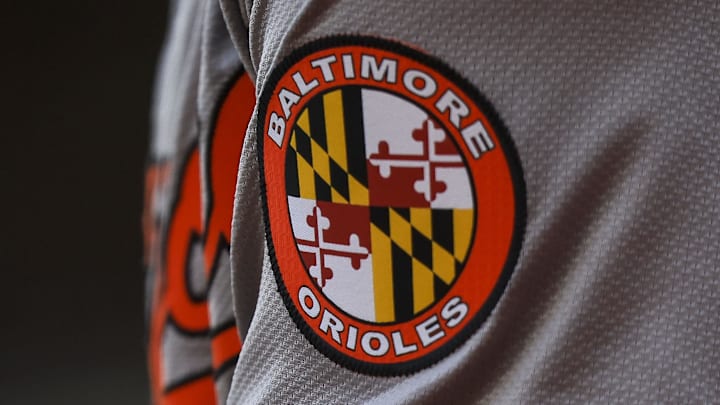 May 5, 2024; Cincinnati, Ohio, USA; The Baltimore Orioles logo on the sleeve of designated hitter Gunnar Henderson (2) as he prepares on deck during the seventh inning against the Cincinnati Reds at Great American Ball Park. Mandatory Credit: Katie Stratman-Imagn Images