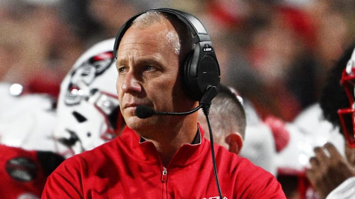 Nov 1, 2025; Raleigh, North Carolina, USA;  NC State Wolfpack head coach Dave Doeren during the first quarter at Carter-Finley Stadium. Mandatory Credit: Zachary Taft-Imagn Images