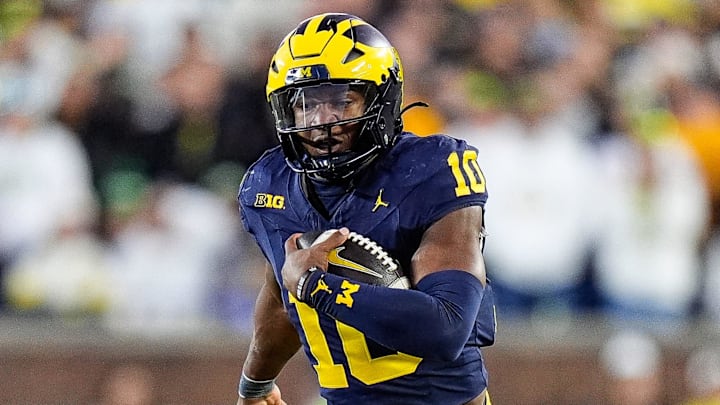 Michigan quarterback Alex Orji (10) runs against Oregon during the second half at Michigan Stadium in Ann Arbor on Saturday, Nov. 2, 2024.