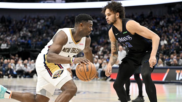 Jan 15, 2024; Dallas, Texas, USA; New Orleans Pelicans forward Zion Williamson (1) and Dallas Mavericks center Dereck Lively II (2) in action during the game between the Dallas Mavericks and the New Orleans Pelicans at the American Airlines Center. Mandatory Credit: Jerome Miron-Imagn Images