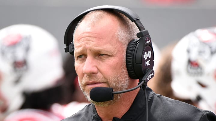 Sep 10, 2022; Raleigh, North Carolina, USA; North Carolina State Wolfpack head coach Dave Doeren prior to a game against the Charleston Southern Buccaneers at Carter-Finley Stadium. Mandatory Credit: Rob Kinnan-Imagn Images Sep 10, 2022; Raleigh, North Carolina, USA; North Carolina State Wolfpack head coach Dave Doeren prior to a game against the Charleston Southern Buccaneers at Carter-Finley Stadium. Mandatory Credit: Rob Kinnan-Imagn Images