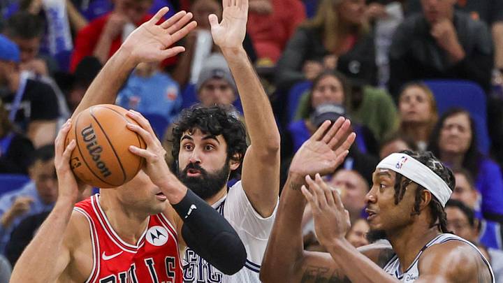 Nov 27, 2024; Orlando, Florida, USA; Orlando Magic center Wendell Carter Jr. (34) and center Goga Bitadze (35) defend Chicago Bulls center Nikola Vucevic (9) during the first quarter at Kia Center. Mandatory Credit: Mike Watters-Imagn Images Nov 27, 2024; Orlando, Florida, USA; Orlando Magic center Wendell Carter Jr. (34) and center Goga Bitadze (35) defend Chicago Bulls center Nikola Vucevic (9) during the first quarter at Kia Center. Mandatory Credit: Mike Watters-Imagn Images