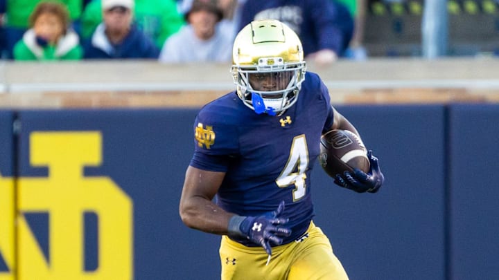 Oct 11, 2025; South Bend, Indiana, USA; Notre Dame Fighting Irish running back Jeremiyah Love (4) runs the ball against the NC State Wolfpack during the second half at Notre Dame Stadium. Mandatory Credit: Michael Caterina-Imagn Images
