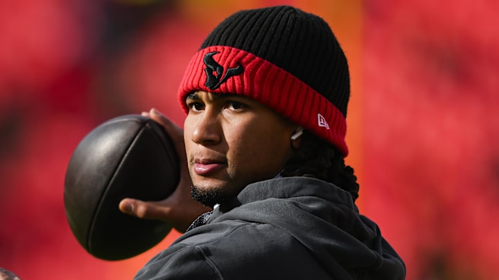Jan 18, 2025; Kansas City, Missouri, USA; Houston Texans quarterback C.J. Stroud (7) warms up prior to a 2025 AFC divisional round game against the Kansas City Chiefs at GEHA Field at Arrowhead Stadium. Mandatory Credit: Jay Biggerstaff-Imagn Images