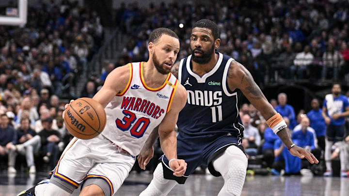 Feb 12, 2025; Dallas, Texas, USA; Golden State Warriors guard Stephen Curry (30) and Dallas Mavericks guard Kyrie Irving (11) in action during the game between the Dallas Mavericks and the Golden State Warriors at the American Airlines Center. Mandatory Credit: Jerome Miron-Imagn Images
