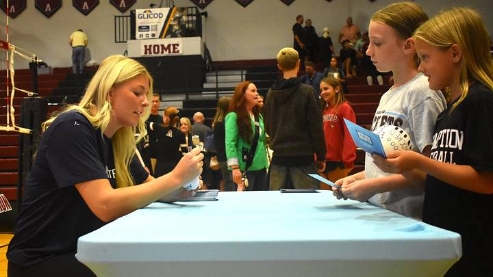 Indy Ignite volleyball player Anna DeBeer signs autographs for young fans at a recent Assumption-Mercy volleyball match. Indy Ignite volleyball player Anna DeBeer signs autographs for young fans at a recent Assumption-Mercy volleyball match.