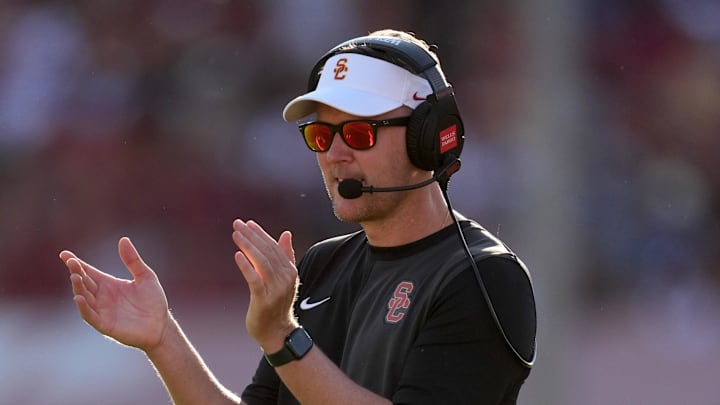 Aug 30, 2025; Los Angeles, California, USA; Southern California Trojans head coach Lincoln Riley watches from the sidelines against the Missouri State Bears in the first half at United Airlines Field at Los Angeles Memorial Coliseum. Mandatory Credit: Kirby Lee-Imagn Images