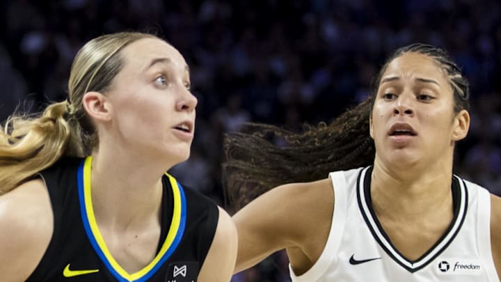 Dallas Wings guard Paige Bueckers drives to the basket as Golden State Valkyries guard Veronica Burton defends.