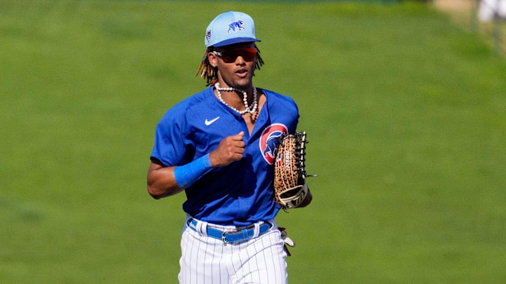 Mar 22, 2024; Mesa, Arizona, USA; Chicago Cubs outfielder Kevin Alcantara (88) returns to the dugout at the bottom of the ninth inning during a spring training game against the San Francisco Giants at Sloan Park