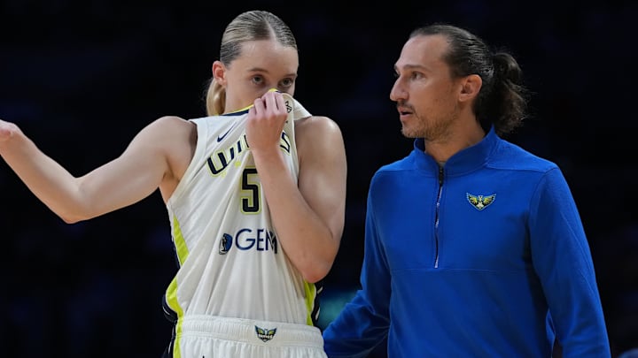 Aug 20, 2025; Los Angeles, California, USA; Dallas Wings coach Chris Koclanes talks with guard Paige Bueckers (5) against the LA Sparks in the first half at Crypto.com Arena. Mandatory Credit: Kirby Lee-Imagn Images Aug 20, 2025; Los Angeles, California, USA; Dallas Wings coach Chris Koclanes talks with guard Paige Bueckers (5) against the LA Sparks in the first half at Crypto.com Arena. Mandatory Credit: Kirby Lee-Imagn Images