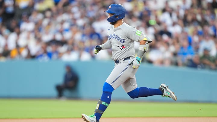 Aug 8, 2025; Los Angeles, California, USA; Toronto Blue Jays shortstop Bo Bichette (11) runs to second base after hitting a double against the Los Angeles Dodgers during the second inning at Dodger Stadium. 