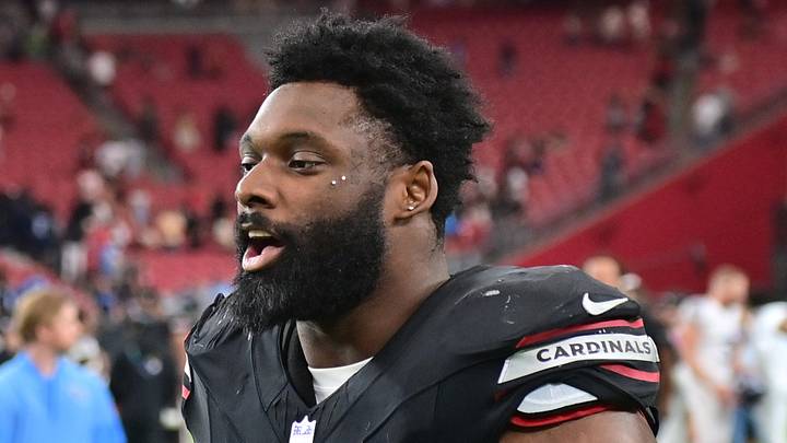 Arizona Cardinals outside linebacker Josh Sweat (10) walks off the field. Arizona Cardinals outside linebacker Josh Sweat (10) walks off the field.
