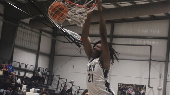 Gray Collegiate Academy forward Makhi Tyler with the slam dunk. Gray Collegiate Academy forward Makhi Tyler with the slam dunk.