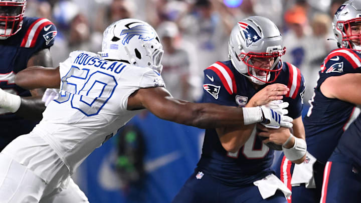 Oct 5, 2025; Orchard Park, New York, USA; Buffalo Bills defensive end Greg Rousseau (50) sacks New England Patriots quarterback Drake Maye (10) during the first half at Highmark Stadium. Mandatory Credit: Mark Konezny-Imagn Images