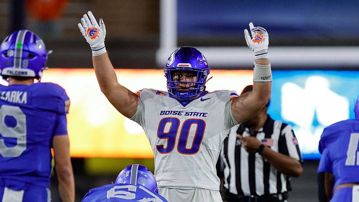 Sep 20, 2025; Colorado Springs, Colorado, USA; Boise State Broncos defensive lineman Braxton Fely (90) motions at the line of scrimmage against Air Force Falcons guard Costen Cooley (67) and quarterback Liam Szarka (9) and fullback Terrence Gist (12) in the fourth quarter at Falcon Stadium. Mandatory Credit: Isaiah J. Downing-Imagn Images
