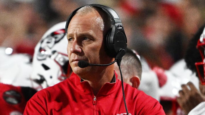 Nov 1, 2025; Raleigh, North Carolina, USA;  NC State Wolfpack head coach Dave Doeren during the first quarter at Carter-Finley Stadium. Mandatory Credit: Zachary Taft-Imagn Images