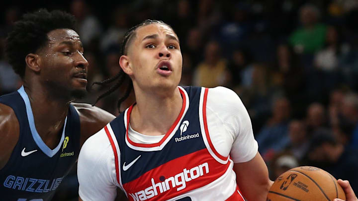 Nov 8, 2024; Memphis, Tennessee, USA; Washington Wizards forward Kyshawn George (18) drives against Memphis Grizzlies forward Jaren Jackson Jr. (13) during the first half at FedExForum. Mandatory Credit: Petre Thomas-Imagn Images