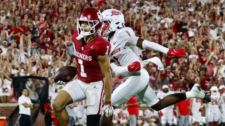 Oklahoma receiver Isaiah Sategna crosses the goal line for a touchdown against New Mexico. Oklahoma receiver Isaiah Sategna crosses the goal line for a touchdown against New Mexico.